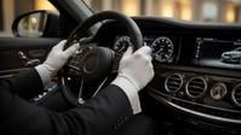 Chauffeur driving an executive sedan